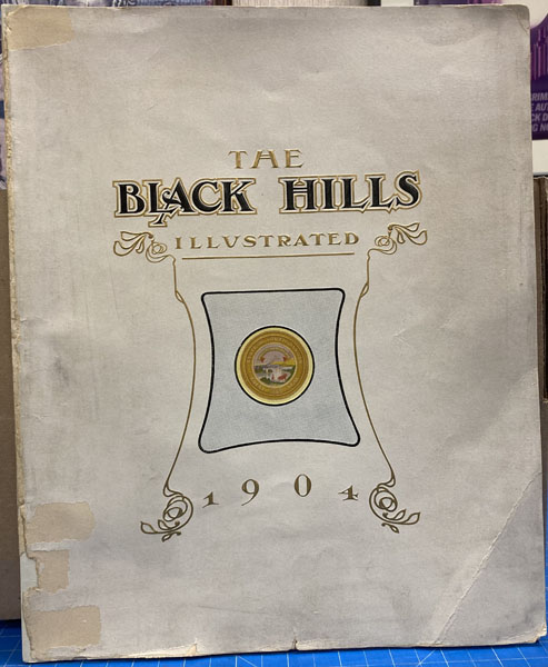 The Black Hills Illustrated. A Terse Description Of Conditions Past And Present Of America's Greatest Mineral Belt, Its Agriculture And Cattle Resources, Principal Cities, Financial, Commercial, Educational And Religious Institutions, Railways, Scenery And Health And Pleasure Resorts. BALDWIN, GEORGE P. [EDITED AND PUBLISHED BY].