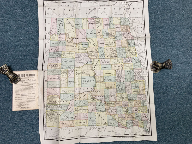 Rand, Mcnally & Co's Indexed County And Township Map Of Dakota With A New And Original Compilation And Index, Designating All Post Office Towns And Railroad Stations, And Giving Full Postal Directions For Sending Mail Matter To Every Place Not A Post Office, In The Territory, Known In The Post Office Department As "Locals," Also, Giving An Alphabetically Arranged List Of The Railroads In The Territory (With The Name Of The Express Company Doing Business Over Such), And Of All Counties, Lakes, Rivers, Etc. Etc. (Cover Title) RAND, MCNALLY & COMPANY