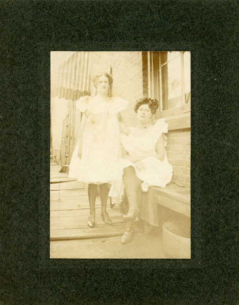 Photograph - Full-Length Photograph Of Two Women Displaying Their Legs While Wearing Fish-Net Stockings PHOTOGRAPHER UNKNOWN