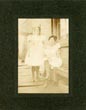 Photograph - Full-Length Photograph Of Two Women Displaying Their Legs While Wearing Fish-Net Stockings PHOTOGRAPHER UNKNOWN