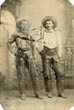 Photograph Portrait Of Two Cowboys In Full Cowboy Gear Reaching For Holstered Sidearms PHOTOGRAPHER UNKNOWN